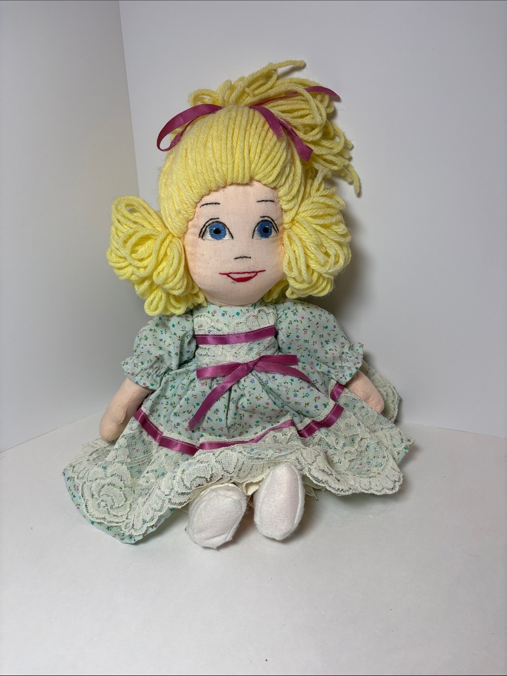 Vintage Hand madeYellow-Haired Doll with embroidered facial features.